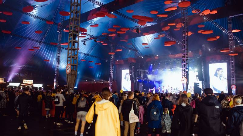 People watching a band on the stage at the Flow Festival