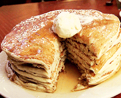 Large plate of pancakes with cream dribbling down them Road Trip USA