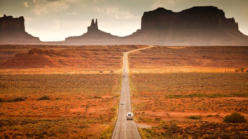 Motorhome camper on road trip USA in the southwest red rock landscape near Monument Valley arizona