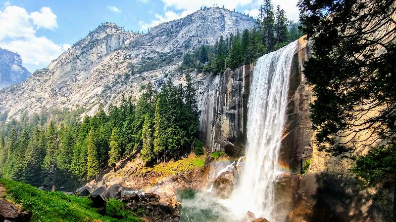 Beautiful waterfalls of Vernal Falls with mountains in the background on America Road Trip USA