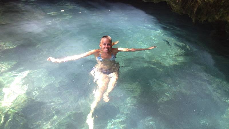 Lady-swimming-in-hidden-pool-in-Cancun