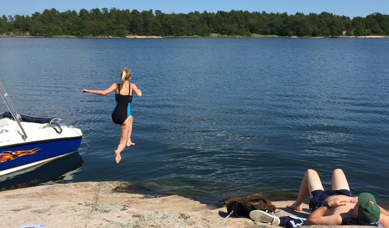 Jumping-off-the-rocks-into-the-water-around-the-Venice-of-the-North