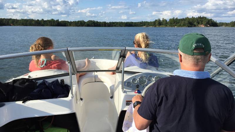 Sitting-in-front-of-boat-on-the-waters-around-the-Venice-of-the-North-Stockholm