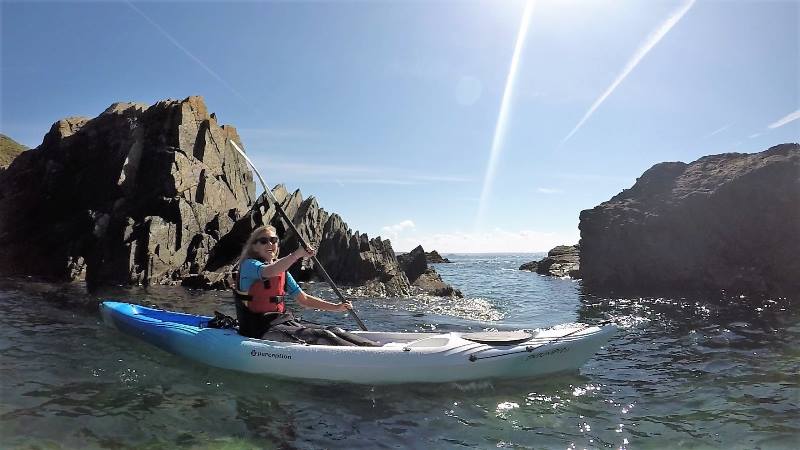 Lady-kayaking-in-the-sea-off-the-coast-of-Wales