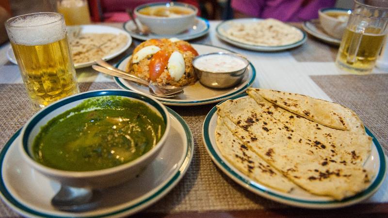 Kathmandu-food-and-culture-a-plate-of-Nepali-food-with-drinks