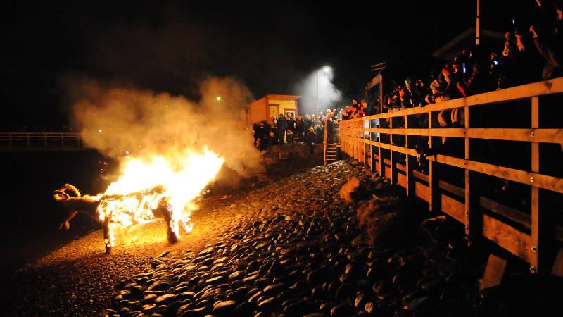 Burning-a-wooden-horse-on-a-beach-in-winter-season