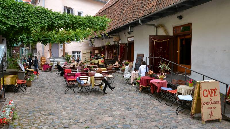 Summer terrace of traditional cafe and chocolaterie in historical town of Tallinn