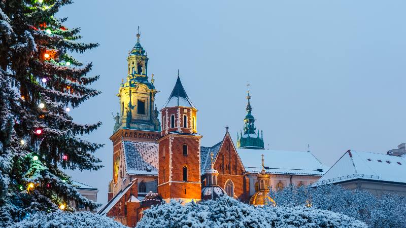 View-of-Christmas-lights-snow-on-the-cathedral-in-Krakow-Poland-for-Winter