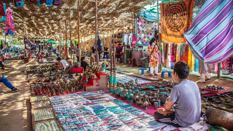 Man-selling-bracelets-in-a-Flea-markets-travel-trends-2020