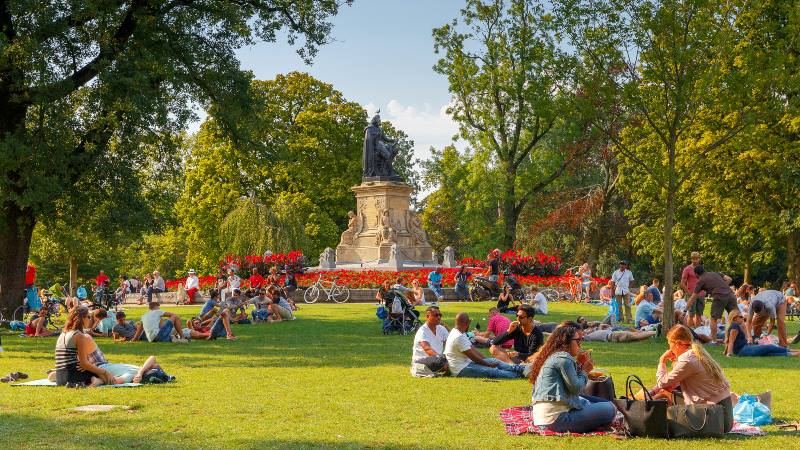 People-sitting-in-Vondelpark-in-Amsterdam-enjoying-the-sunshine