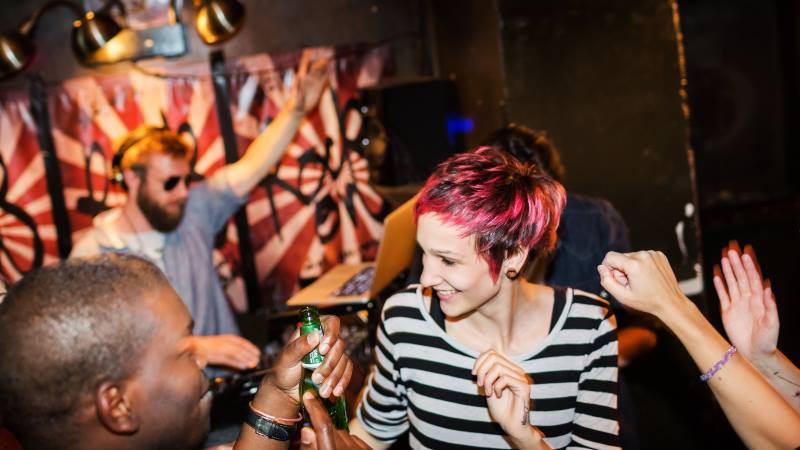 Lady with red hair dancing at a nightclub - berlin sightseeing 