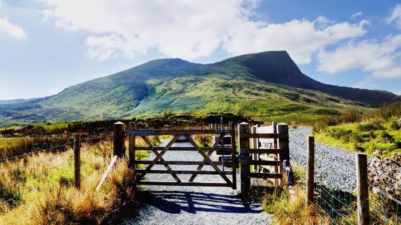 View-of-Snowdonia-in-the-distance-with-a-gate-in-the-foreground