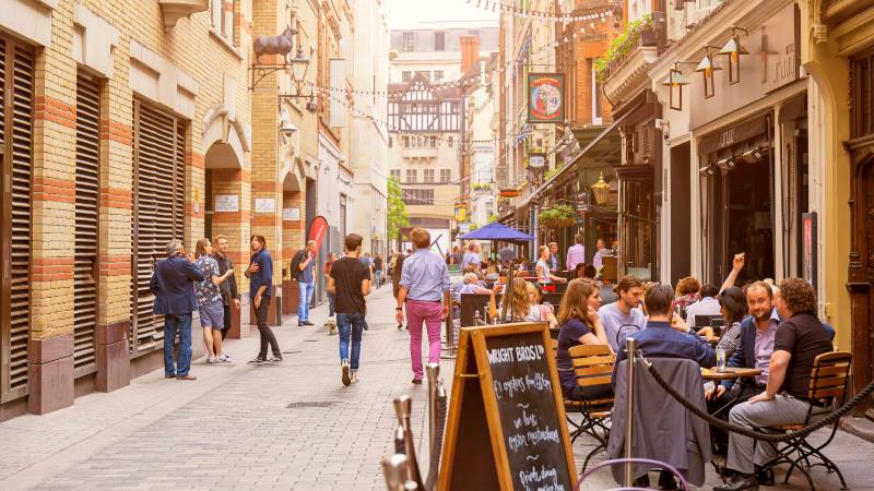 Soho-area-of-London-people-walking-down-kingly-street-fish-and-chips