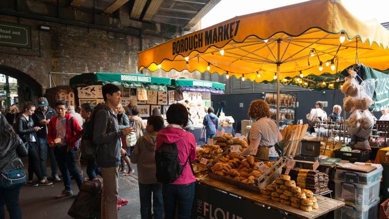 Travelers-and-locals-shopping-for-fresh-food-early-in-the-day-at-the-famous-Borough-Market