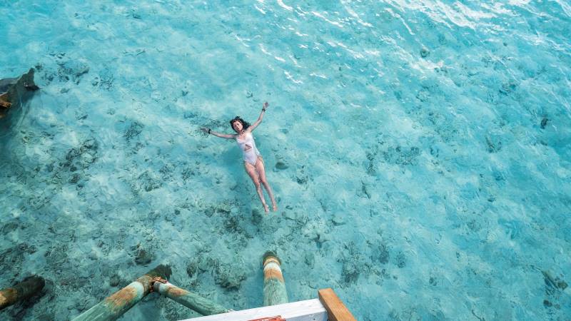 Lady-lying-on-her-back-in-the-sea-enjoying-the-sun-mental-health