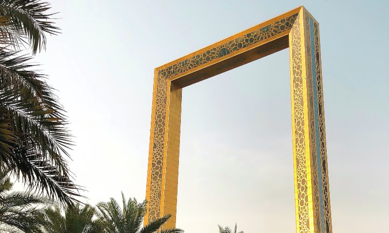Looking at the top of the Dubai frame with palm trees in the view
