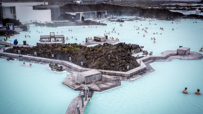 View of the Blue Lagoon with people relaxing in the warm waters